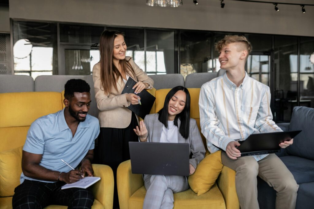 Small business team of ten employees collaborating, representing HR outsourcing and PEO services